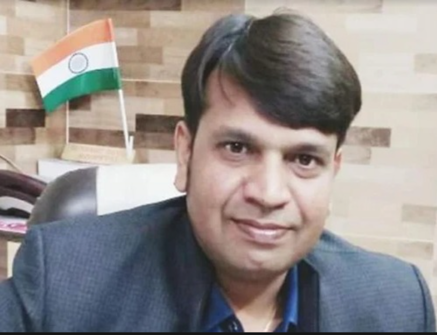Dr. Avneesh Singhal seated at his consultation desk